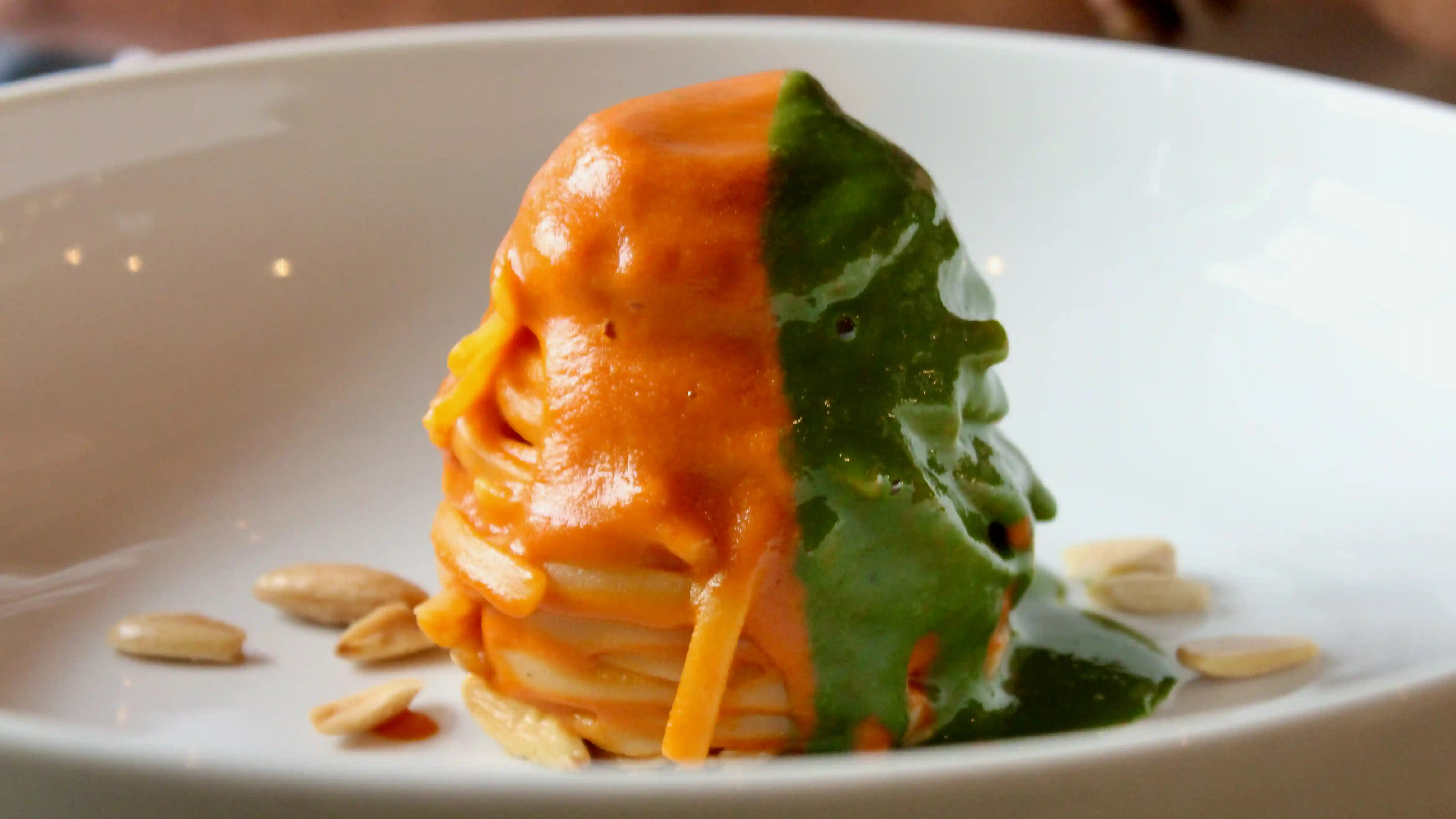 spaghetti with tomato and pesto sauces