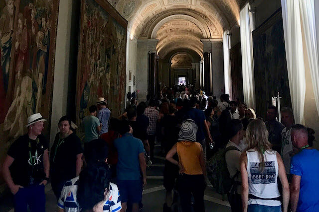 vatican museums tapestries room with crowds